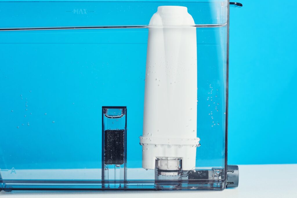 Filter water purification in the coffee machine container. Kitchen appliances