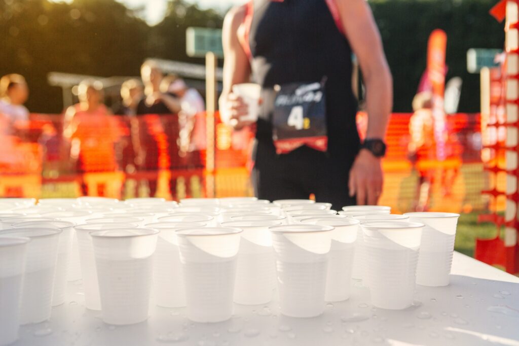 Table with cups of water at sports event